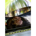 Cuisson d'un steak sous la cloche en inox Campingaz