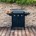Barbecue Select 4 EXS Campingaz installé sur une terrasse en bois