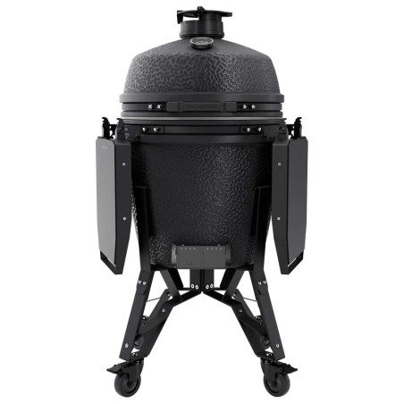 Vue de face sur le barbecue charbon The Bastard Pro Large Complete Graphite tablettes rabattues et couvercle fermé