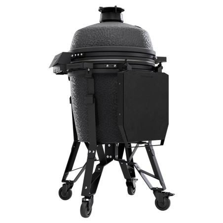 Vue de face sur le barbecue charbon The Bastard Pro Large Complete Graphite tablettes sur le devant