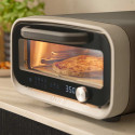 Vue sur la cuisson en cours du four à pizza électrique Volt 2 Ooni