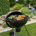 Cuisson d'aliments sur le barbecue charbon Smok 60 Cook'in Garden